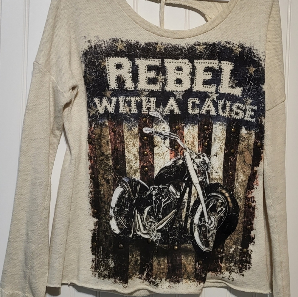THE CLAS-SIC  CUT OUT BACK SHIRT.